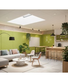 Revêtement mural acoustique Chevron vert installé dans une salle de détente moderne avec coin café.